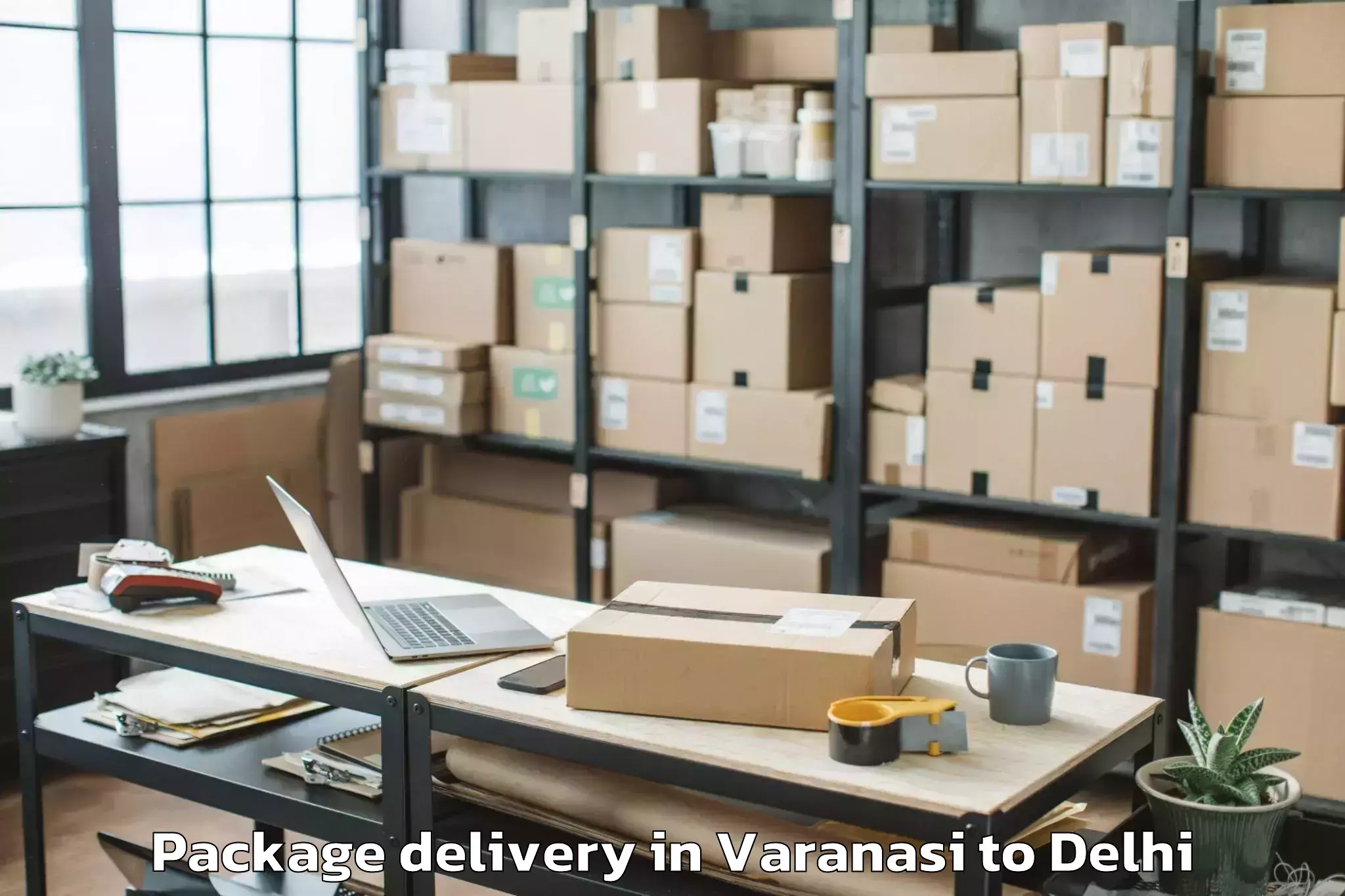 Book Varanasi to Dlf Promenade Mall Package Delivery Online